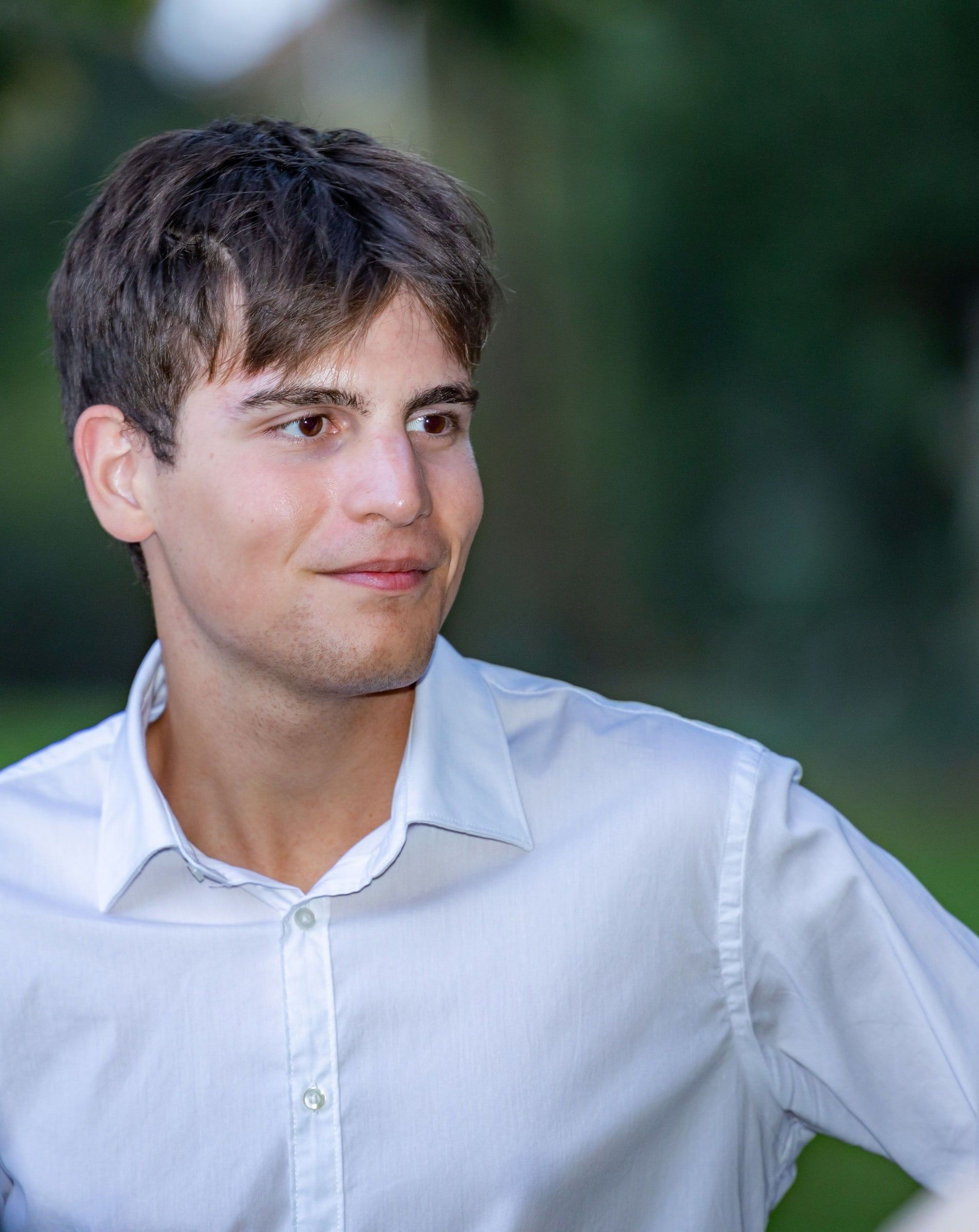 Stefano in a white shirt, outdoors